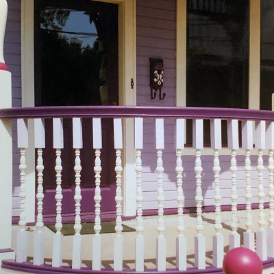 curved railing on porch of Painted Lady   